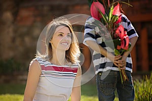 Cute little boy, giving present to his mom for Mothers day