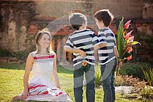 Cute little boy, giving present to his mom for Mothers day