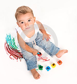 Cute little boy and gouache