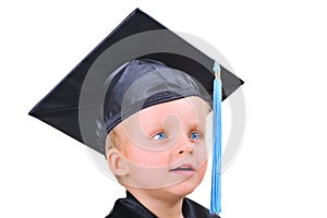 Cute little boy in graduation gown