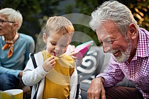 Cute little boy with grandpa enjoyng