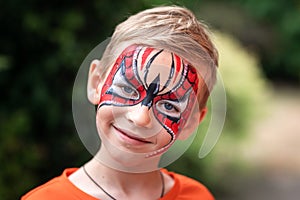 Cute little boy with his face painted