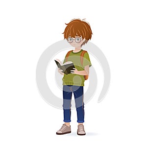 Cute little boy is holding book in her hands and reading it.