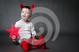 Cute little boy with horns