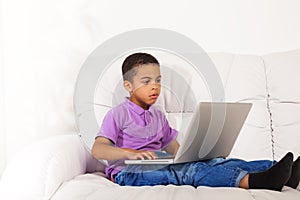 Cute little boy with laptop