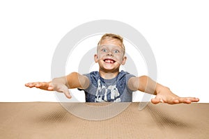 Cute little boy opening the biggest postal package