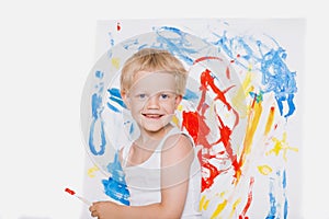 Cute little boy painting with brush. School. Preschool. Education. Creativity