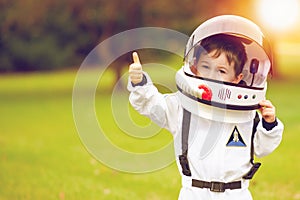 Cute little boy playing astronaut