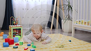 cute little boy playing with blocks in the children's room