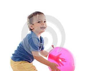 Cute little boy is playing with pink balloon