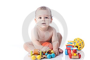 Cute little boy is playing with toys