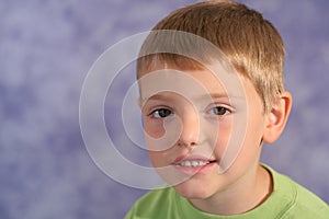 Cute little boy portrait on bl