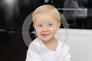 A cute little boy. Portrait of a child in the kitchen