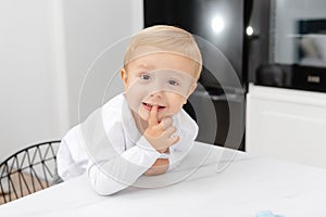 A cute little boy. Portrait of a child in the kitchen