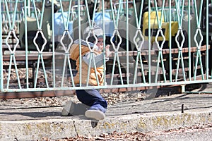 Cute little boy portrait on the playground in city