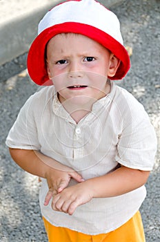 Cute little boy with a puzzled