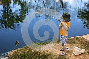 Little Boy Catching a Fish photo
