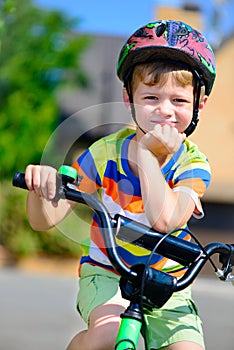 Cute little boy riding bicycle