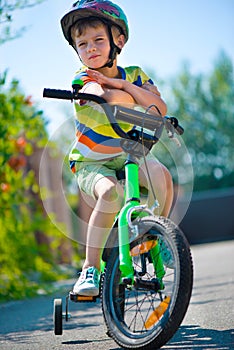 Cute little boy riding bicycle