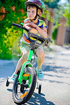 Cute little boy riding bicycle