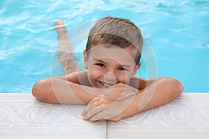 Cute little boy in swimming pool