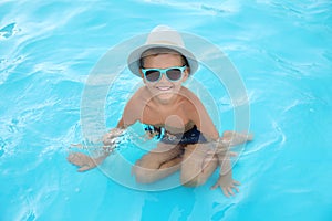Cute little boy in swimming pool