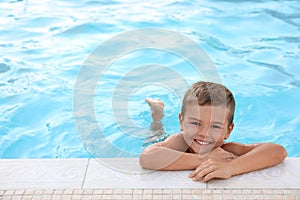 Cute little boy in swimming pool