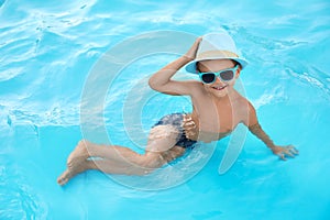 Cute little boy in swimming pool