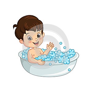 Cute little boy taking a bath in bathtub
