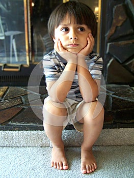 Cute little boy thinking