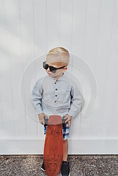 Cute little boy in a trendy summer outfit