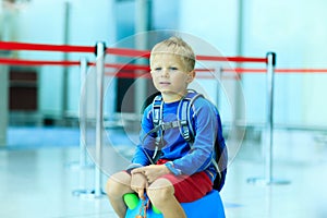 Cute little boy waiting in the airport