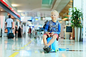 Cute little boy waiting in the airport