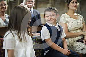 Cute little boy waiting for the bride to arrive photo