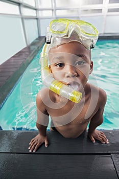 Cute little boy wearing snorkel and goggles