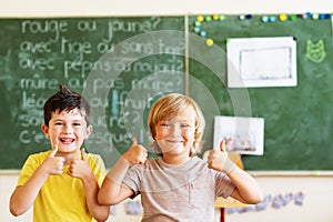 Cute little boys working in classroom