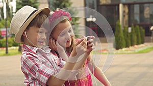 Little children take selfie outdoors