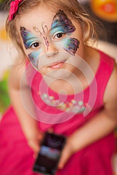 Girl with butterfly face painting