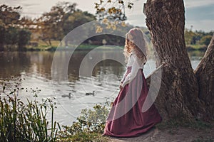 Cute little caucasian girl wearing retro clothes. Nice female child in beautiful vintage dress.