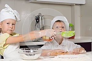 Cute Little Chefs Baking While Playing in Kitchen