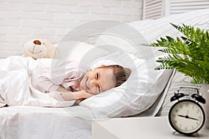 Cute little child girl sleeping with teddy bear