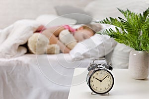 Cute little child girl sleeping with teddy bear