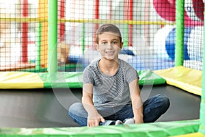 Cute little child playing at indoor park