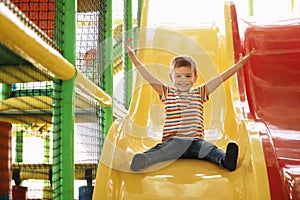 Cute little child playing at indoor park