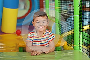 Cute little child playing at indoor park