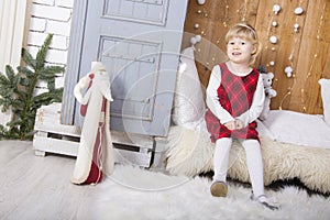 Cute little child sit in wardrobe at christmas