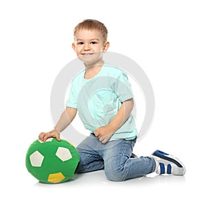 Cute little child with soft soccer ball. Playing indoors