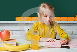 Cute little child studying in classroom at elementary school. Genius child, knowledge day. Kids education and knowledge.