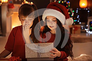 Cute little children with Christmas gift box