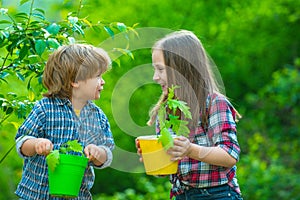 Cute little children enjoying on farm. Ecology concept child. Gardening with a kids.